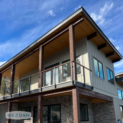 Exterior cable railing with CR1750 and CR1751 fascia mount posts, CR1790 brackets, and stainless CR1600 cable on a raised deck.