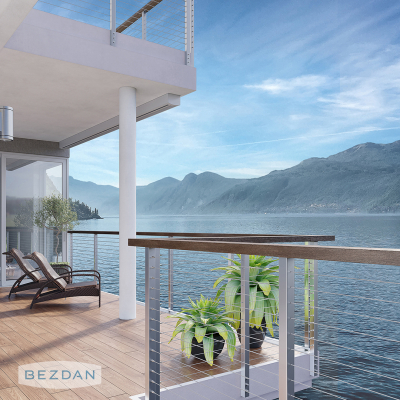 Balcony cable railing with CR1605 tensioner, CR1610 non-tensioner, and CR1600 stainless cable overlooking the lake.