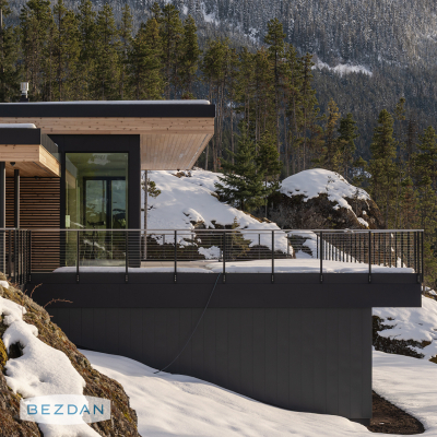 Modern exterior cable railing with CR1750 and CR1751 posts, CR1790 brackets, and CR1706 fittings on a mountain home balcony.