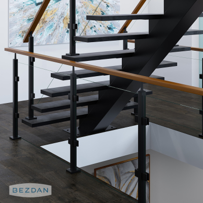 Modern glass railing with square posts 9458 and 9457, glass clips ST223SB-BK, and wood top rail on an open staircase.