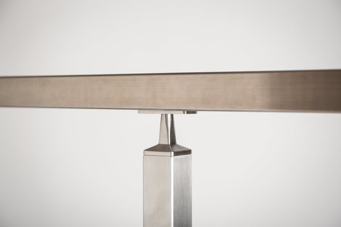 Brand: Bezdan Stainless A close-up shot of a short stem handrail bracket in satin stainless steel finish
