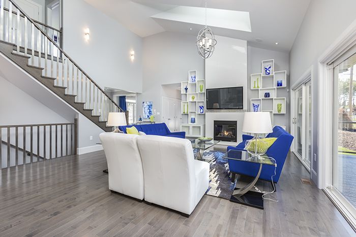 Photo Source: Bezdan Sales MIX AND MATCH. Stainless steel spindles can pair beautifully with the warm tones of this wood-frame handrail in a transitional or contemporary room.