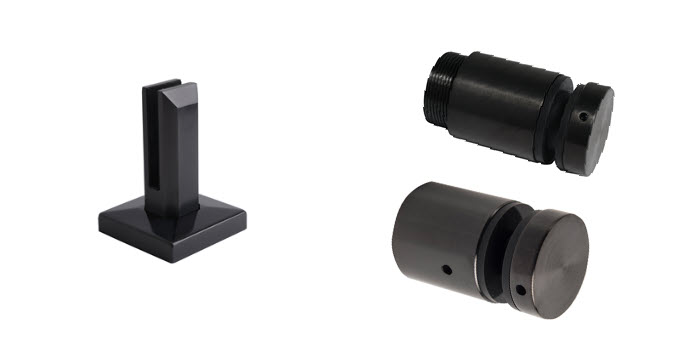 Black PVD-finished stainless steel glass railing hardware, including a square black stainless steel railing standoff base and cylindrical glass standoffs, showcasing durable black stainless components designed for frameless glass railing systems.